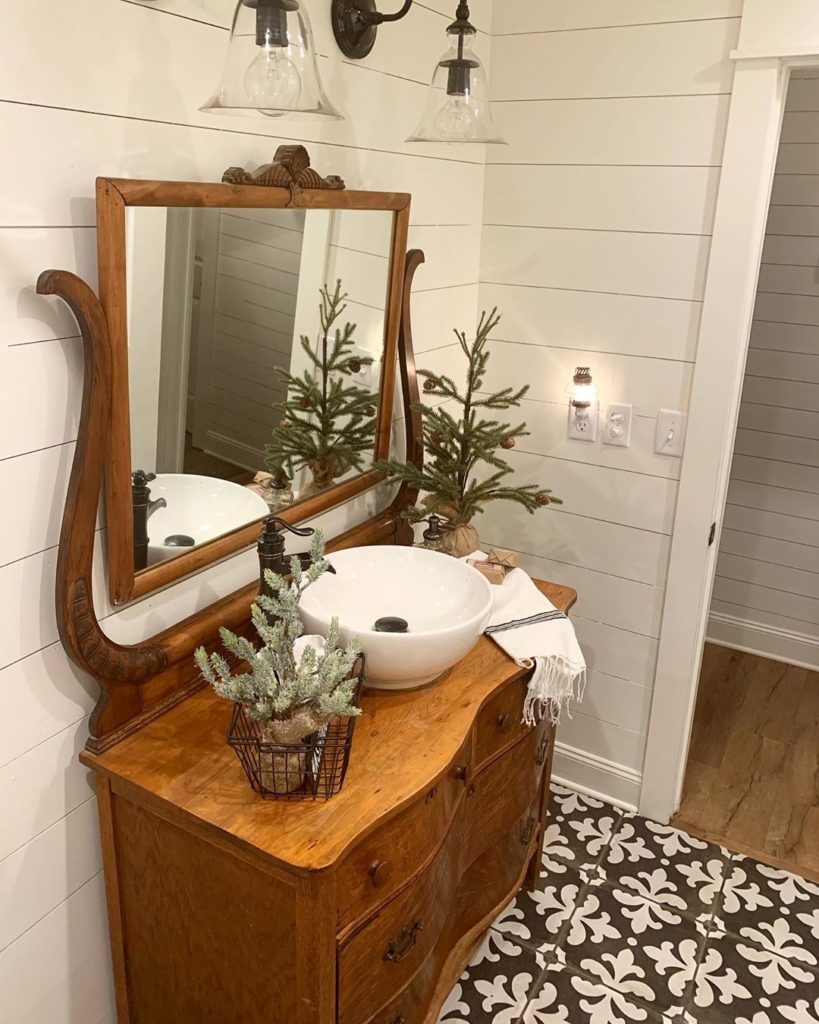 rustic bathroom with Christmas decoration and shiplap walls Bathroom Lighting Ideas