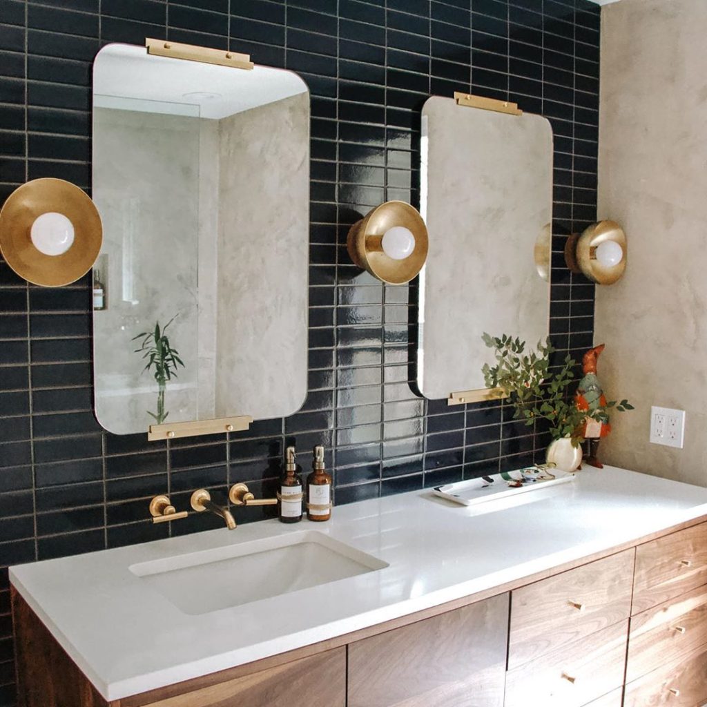 Art Deco style bathroom with black and gold accents and lime washed walls Bathroom Lighting Ideas