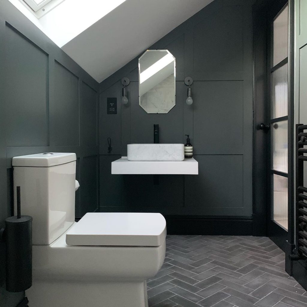 charcoal gray batroom with gray subway tiles on floor