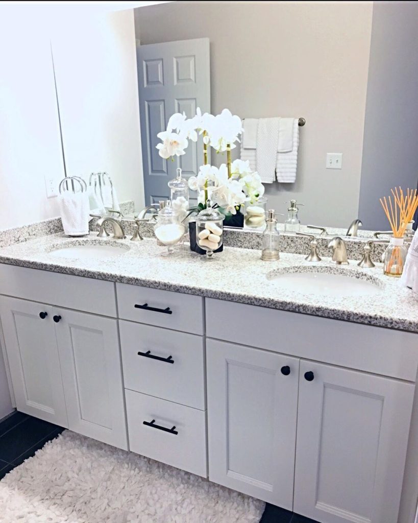 double white vanity iwth marble countertop