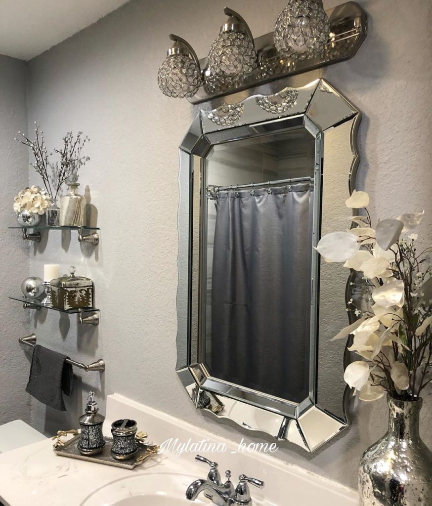 gray bathroom idea with mirror and metalic shelves