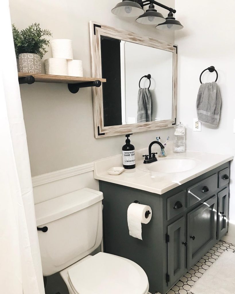 guest bathroom with charcoal vaniy and rustic shelf