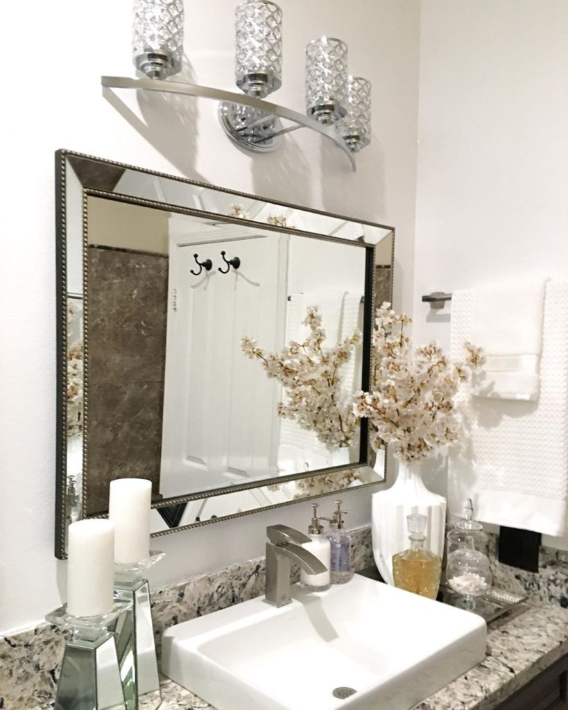 regal guest bathroom with flowers and sink