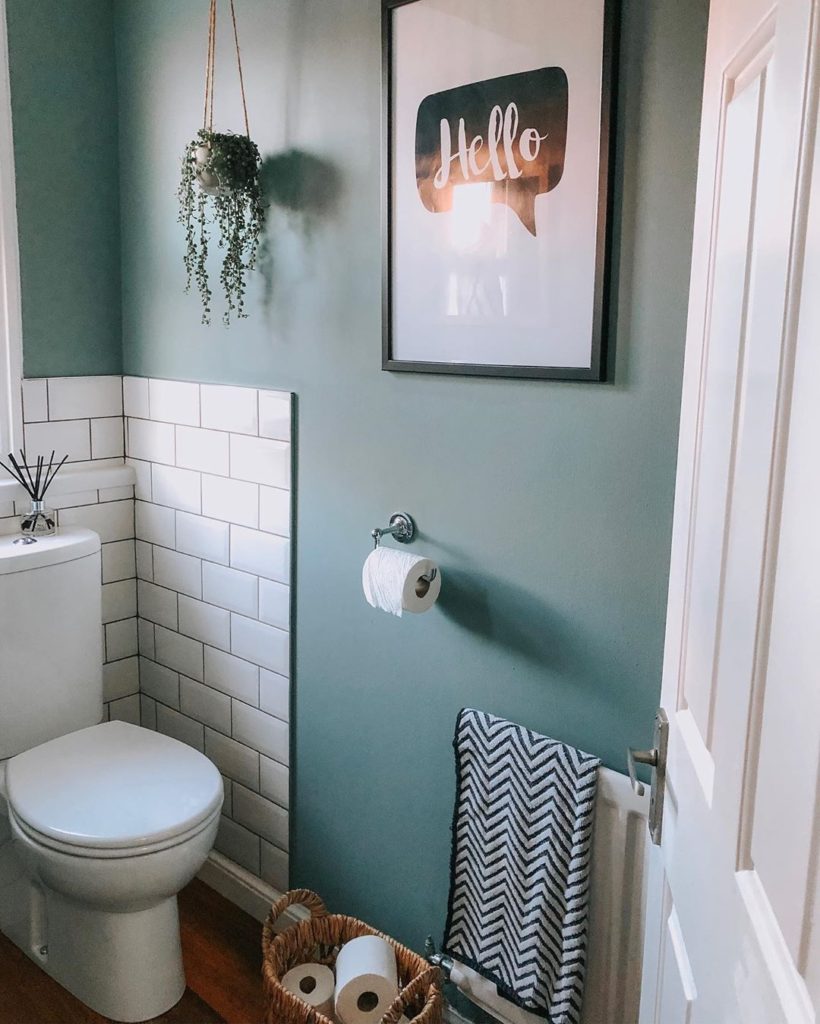 teal bathroom with subway tile