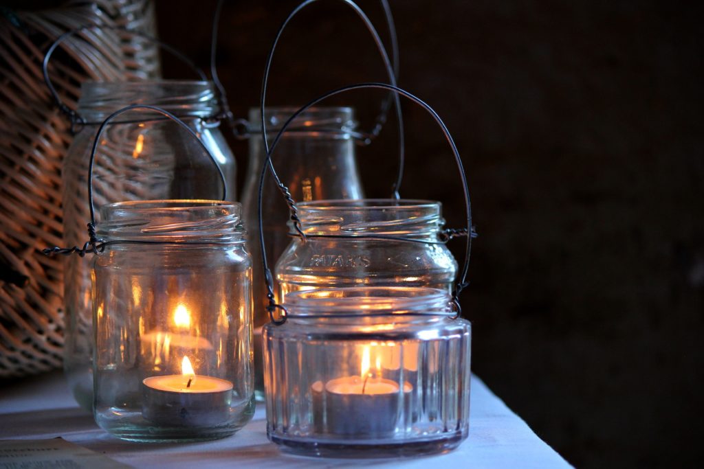 mason jars with candles inside