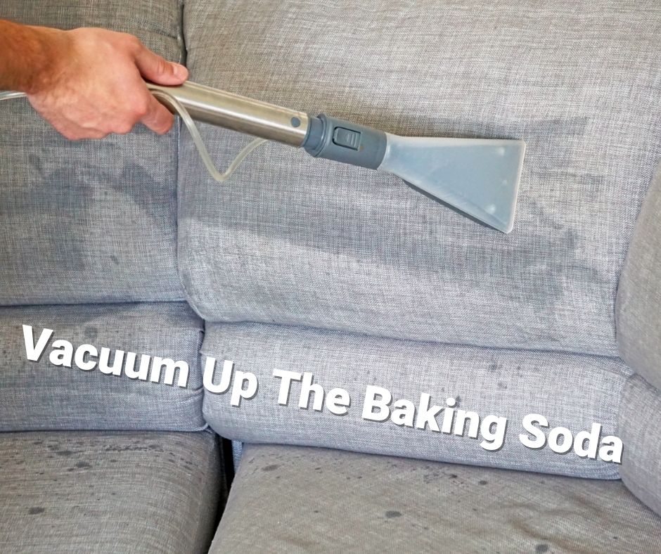 Vacuuming baking soda off of couch