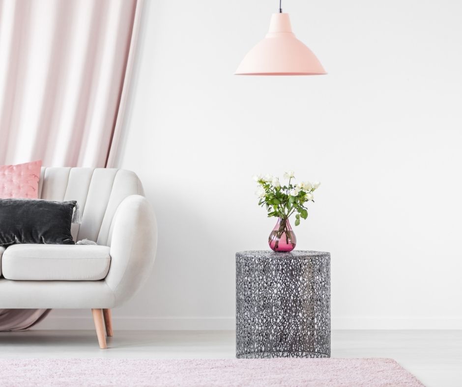 rose pink rug under gray couch