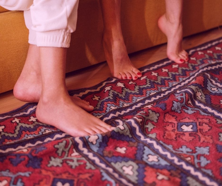 bohemian rug and red couch