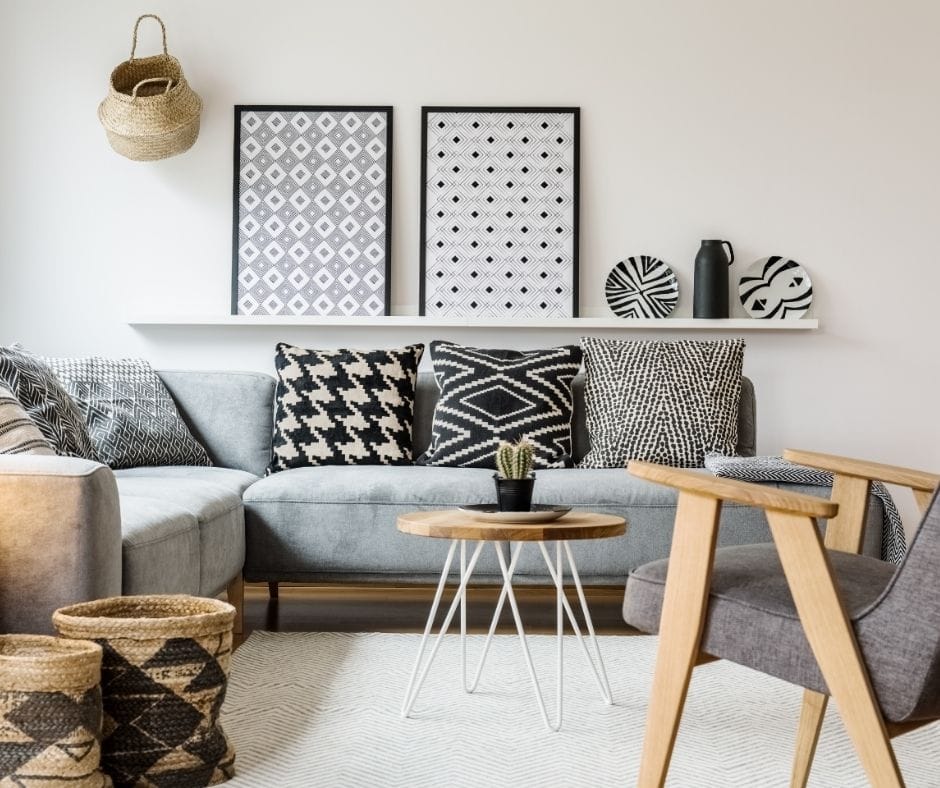 gray couch with white rug