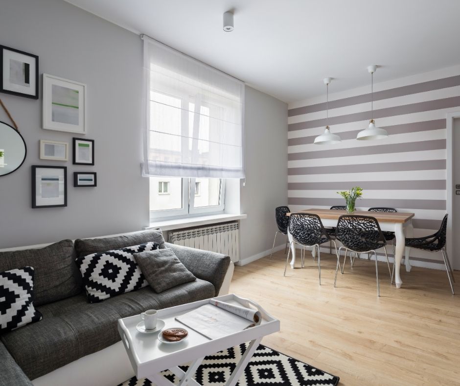 couch with black and white rug under it