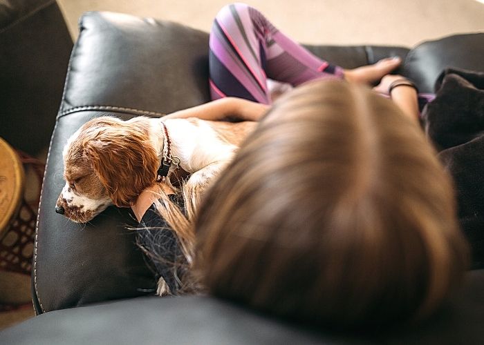 girl sleeping in a recliner testing it for comfort