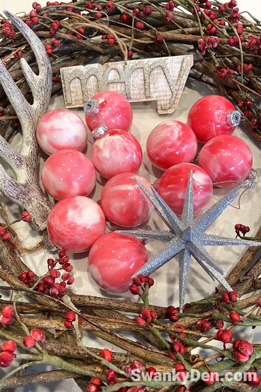 marble christmas ornaments displayed inside a wreath