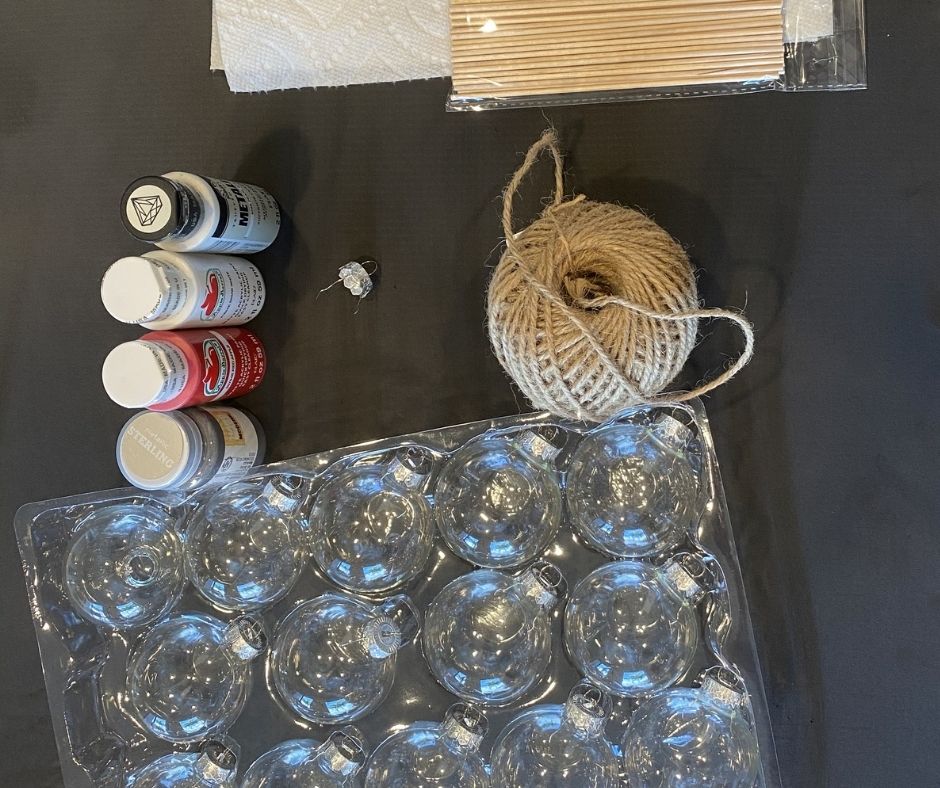 Acrylic paint, twine, and glass buables being prepared to be marbelized