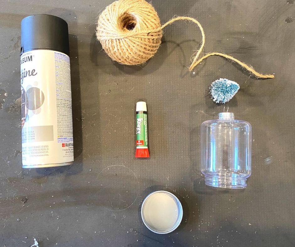 Twine , super glue, plastic mason jar, and matte black spray paint for diy rustic style christmas ornament