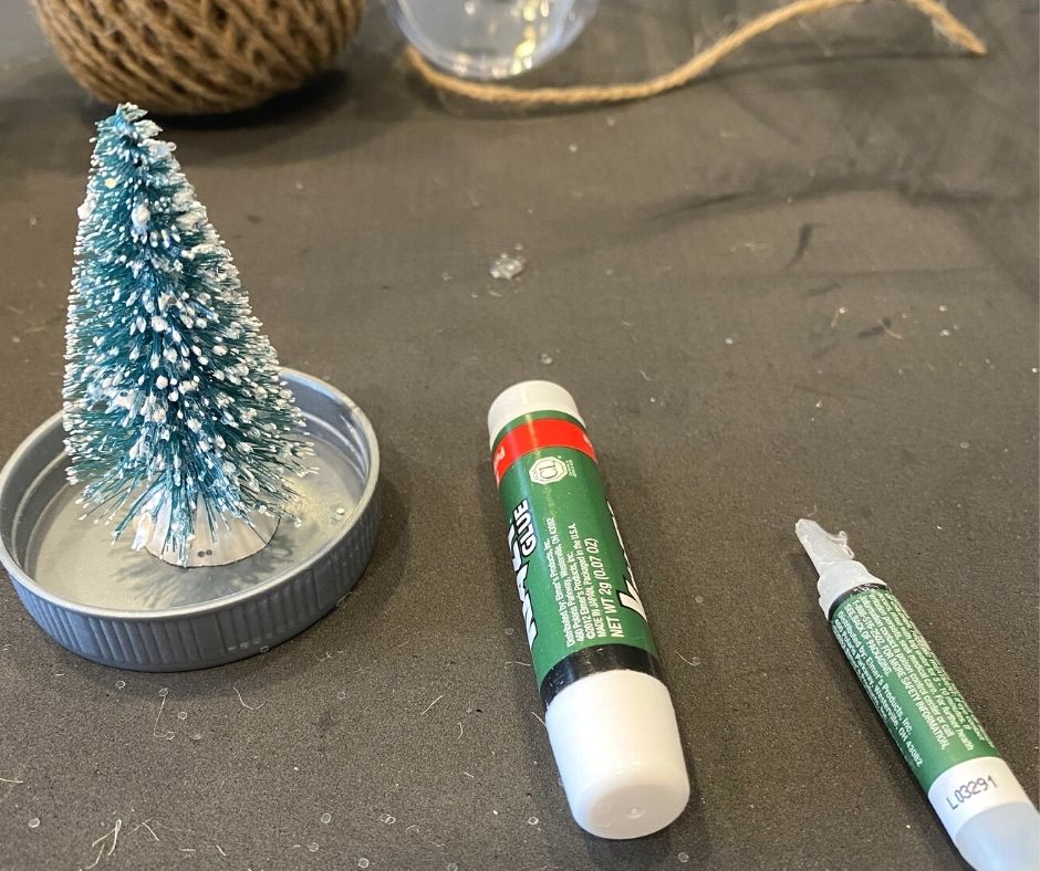 Ornament with crazy glue being attached