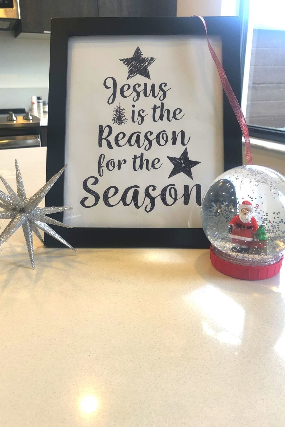 jesus is the reason for the season quote and snow globes on display