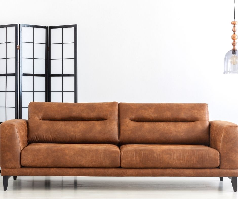 leather sofa being cleaned