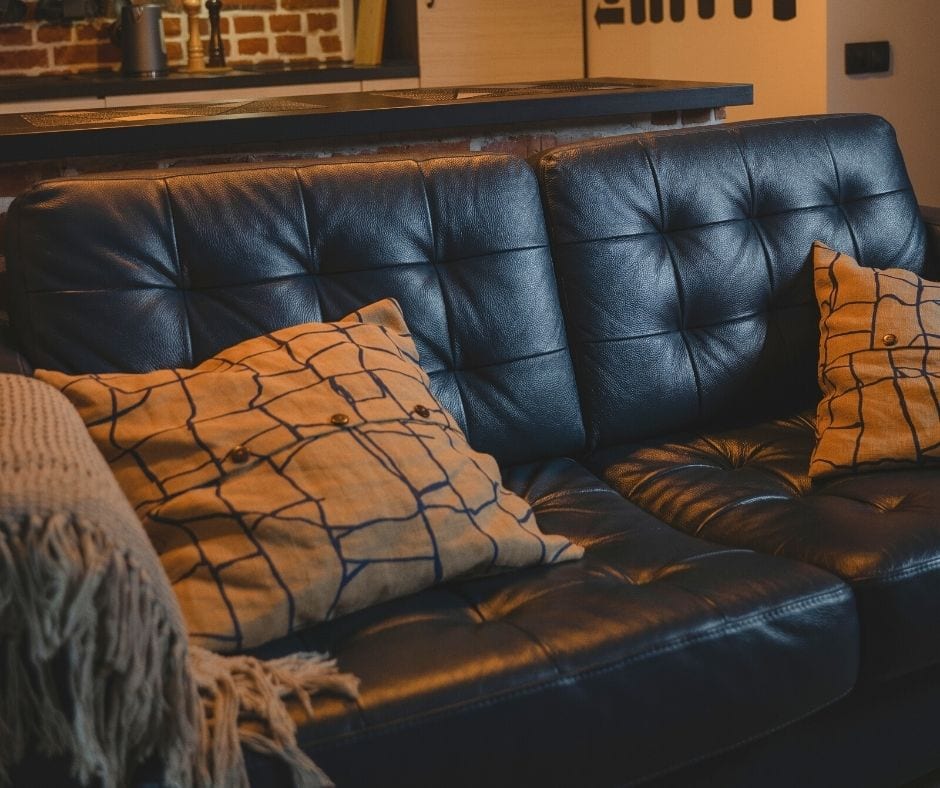 Bonded leather couch with pillows