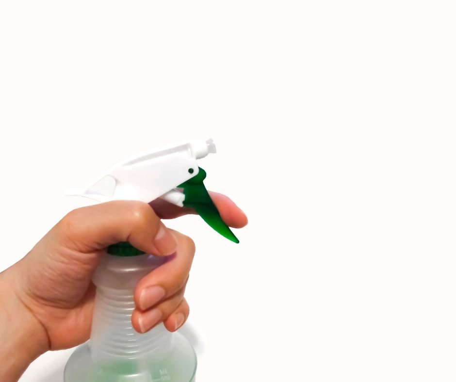 spray bottle being sprayed