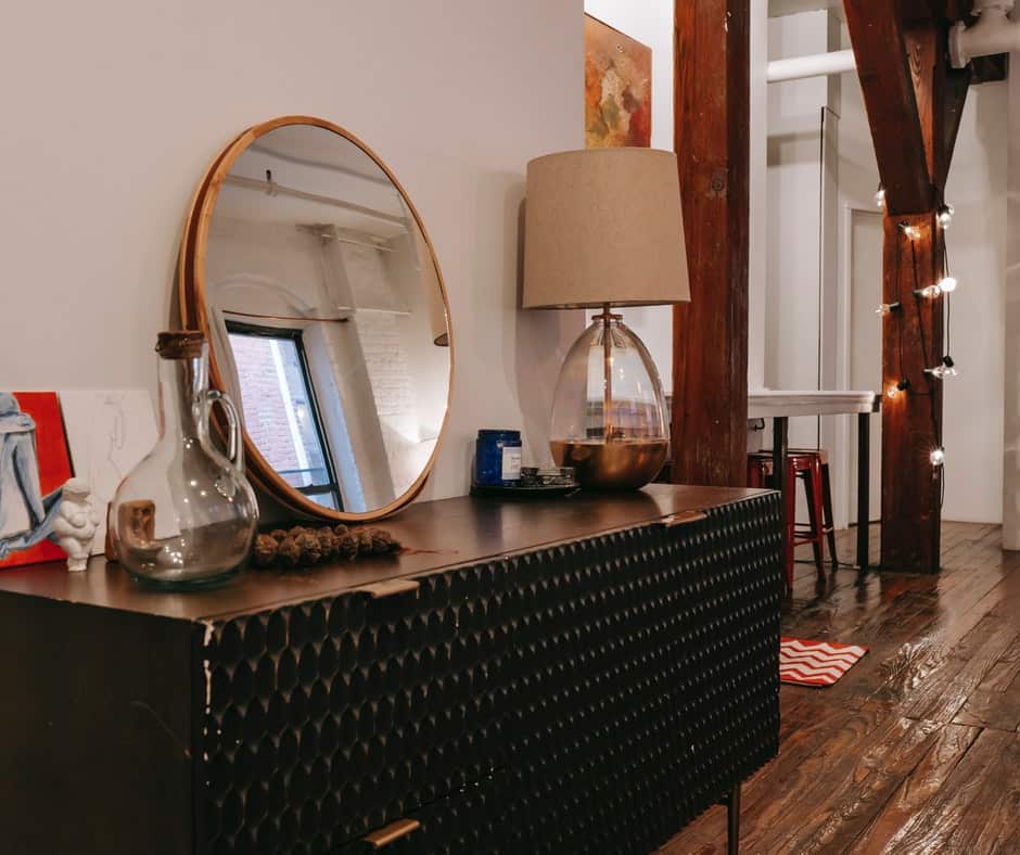 Bedroom dresser with mirror, lamps and decorative pieces