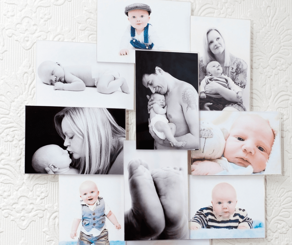 Printed photos of a family posted on a wall