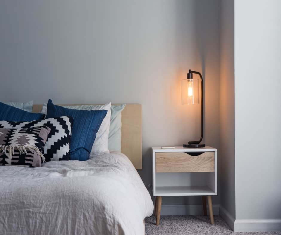 A wooden night stand with a drawer and bottom shelf