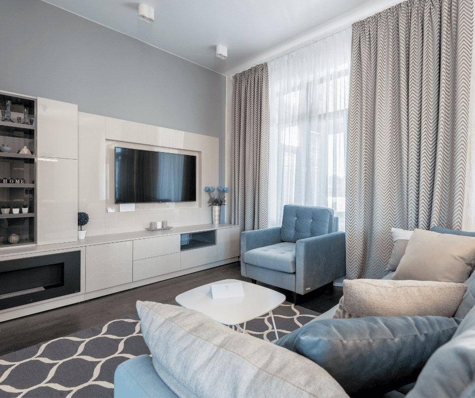 Gray and white rug on dark wooden floor