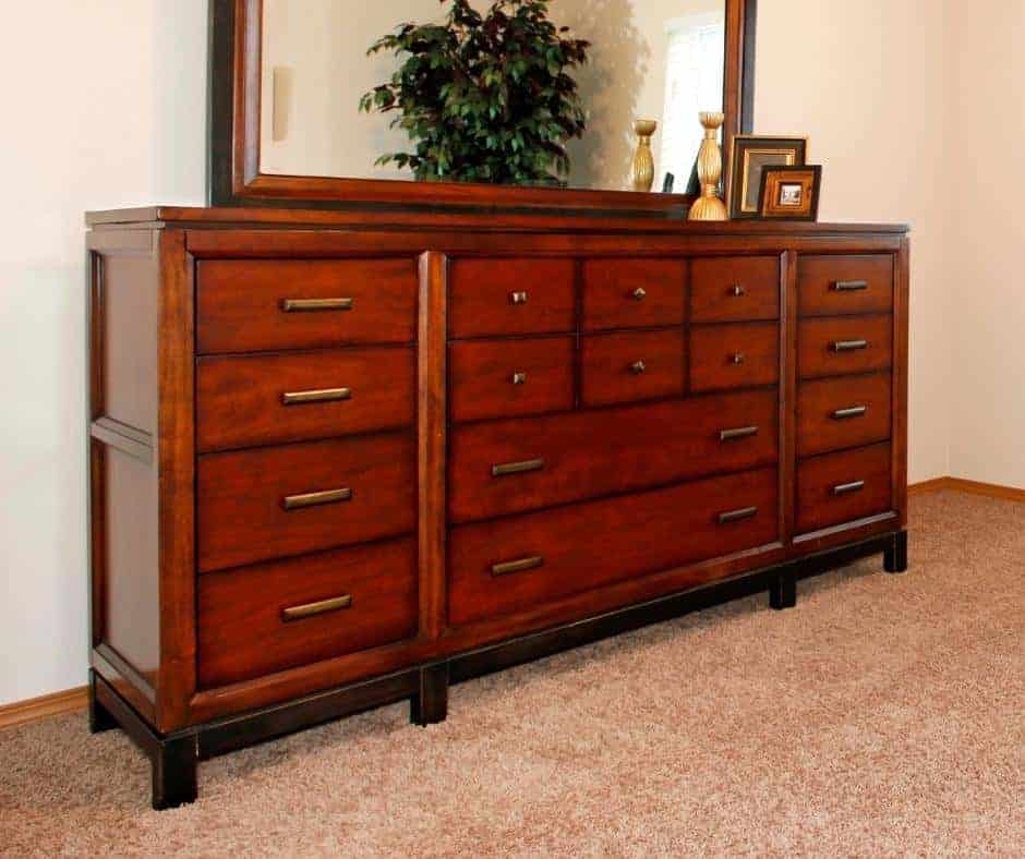 awesome cherry dresser standing on a rug in a room