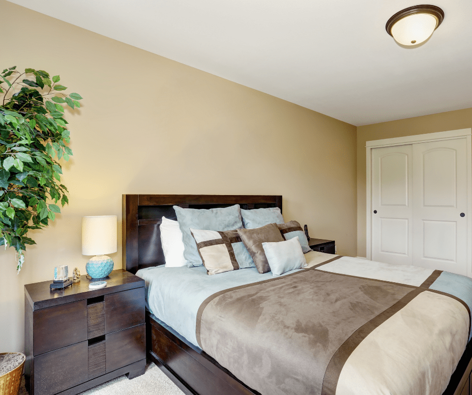 Brown bed with green decor