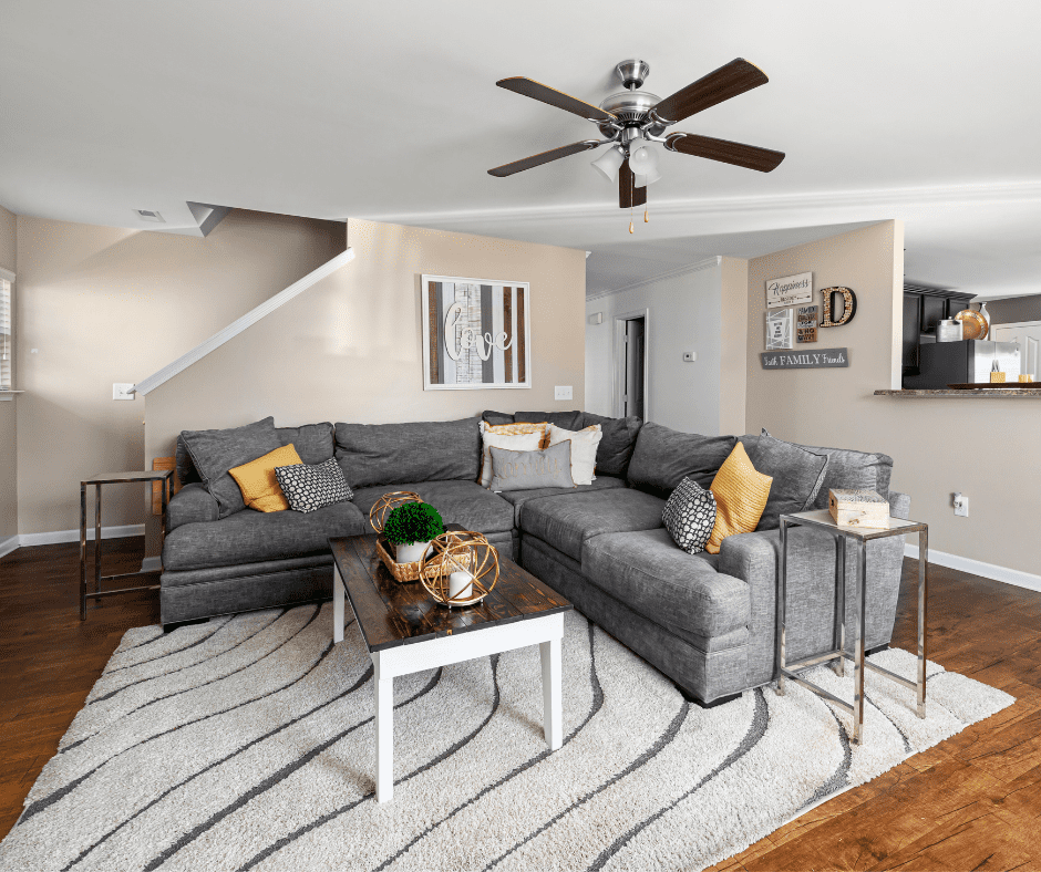 Gray rug on dark wooden floor