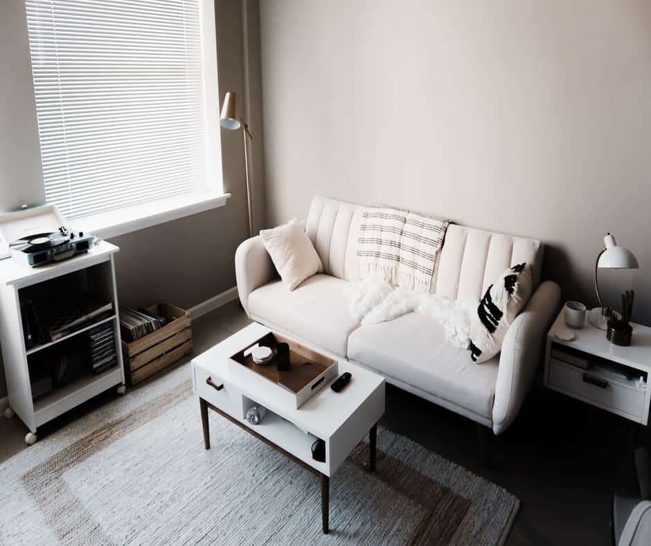 Simple living room with a blind on the window