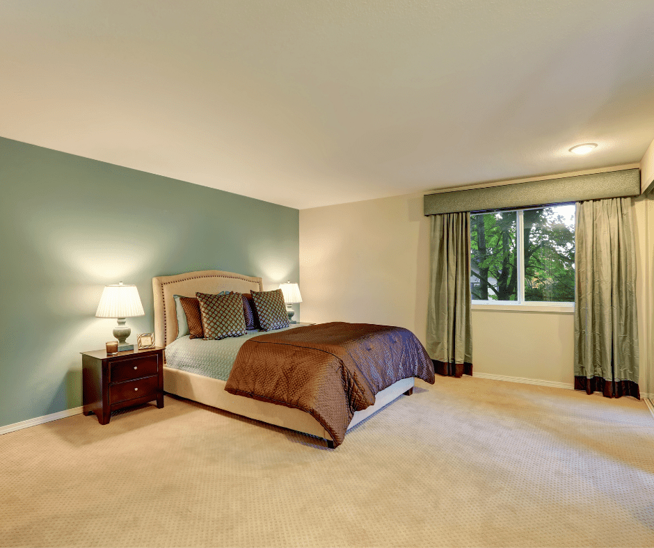 Brown bed with green wall