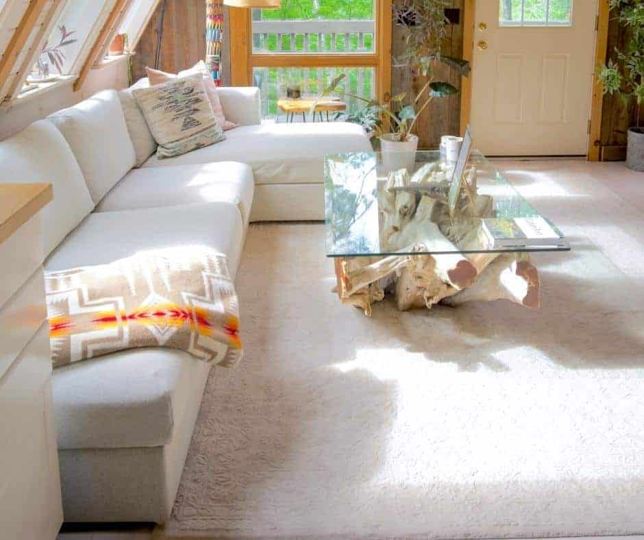 neutral rug sitting under couches in a room