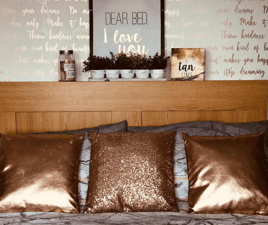 Brown bed with metallic copper decor