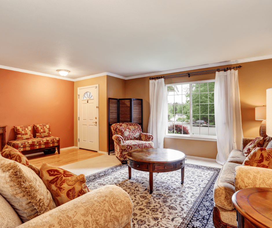 Living room with dark colored traditional rug