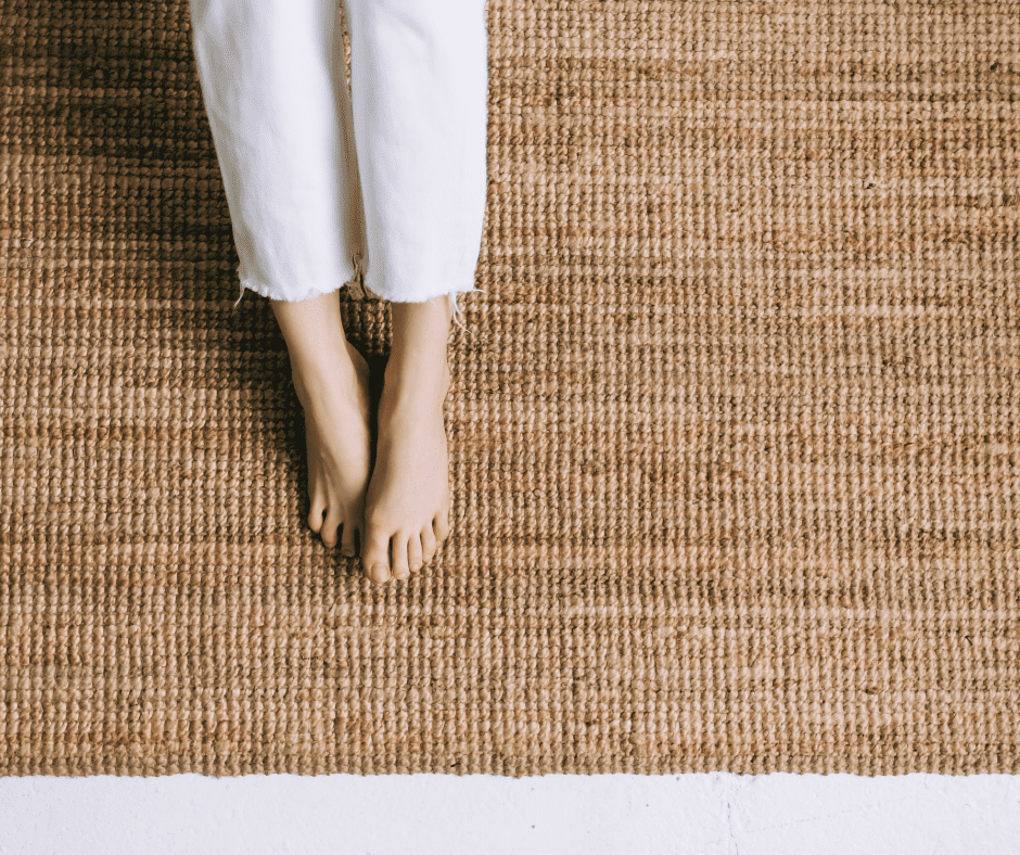 Woman's feet on a jute rug