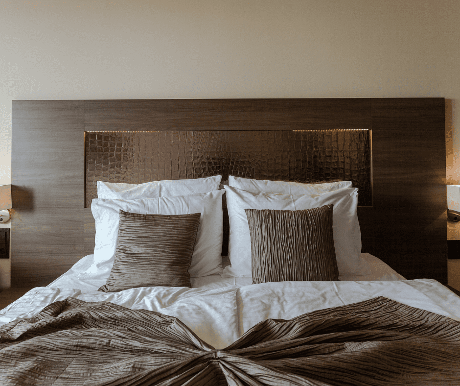 Brown bed with beige wall