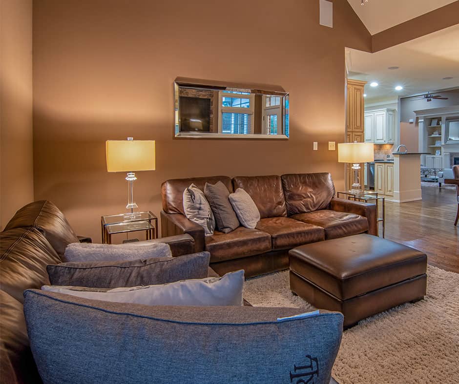 Leather sofa with neutral colored rug