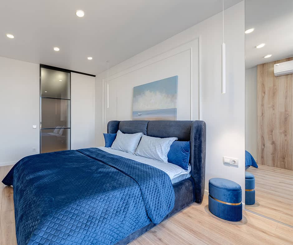 Bedroom with headboard and wall behind it as focal point