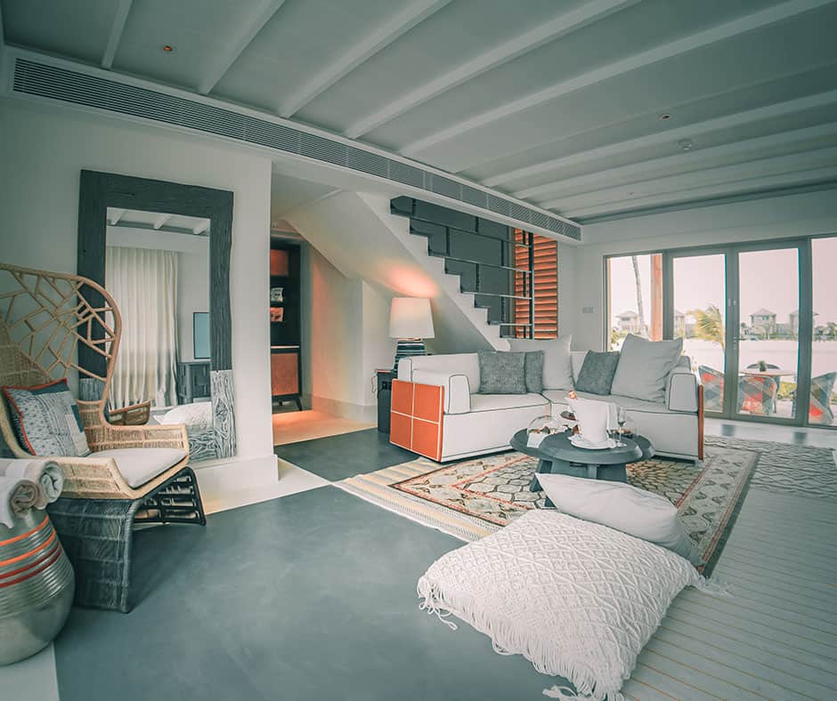 Spacious living room with a clean layout and interesting rug