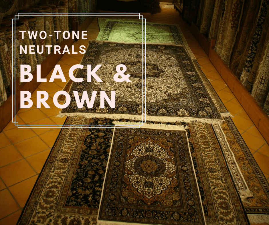 Black and brown rug on dark wooden floor