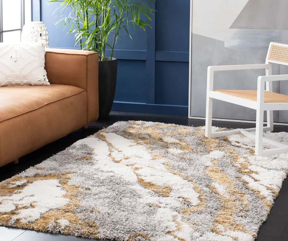 Living room with a soft ivory and gold high pile rug