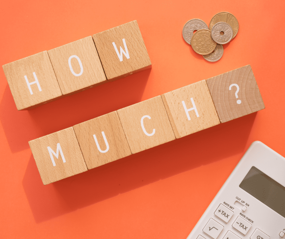 7 wooden blocks with letters printed on it spelling out "how much," some coins, and a calculator