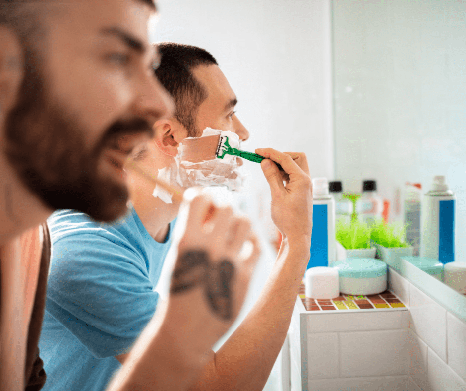 Male siblings using the mirror in their Jack and Jill bathroom