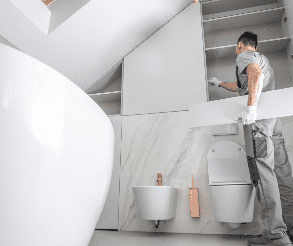 Man checking cabinetry in a Jack and Jill bathroom