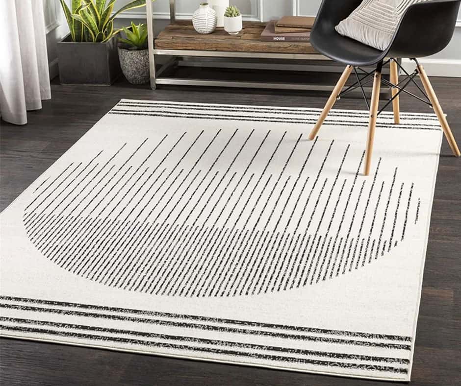 Living room with an ivory and black geometric rug