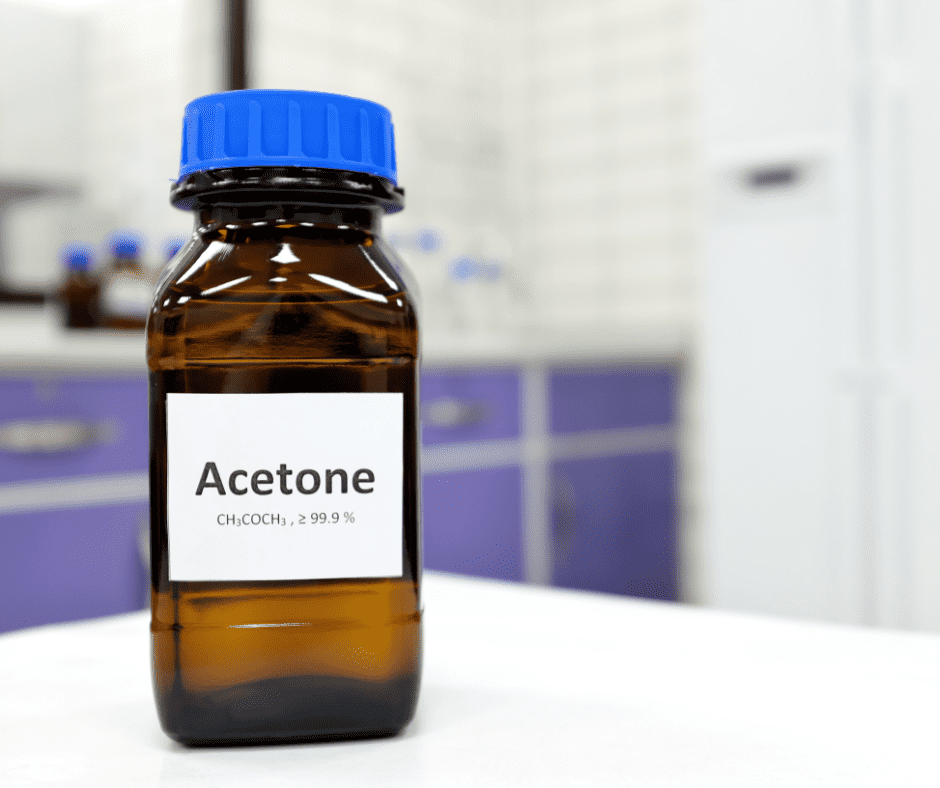 A bottle of acetone on a table