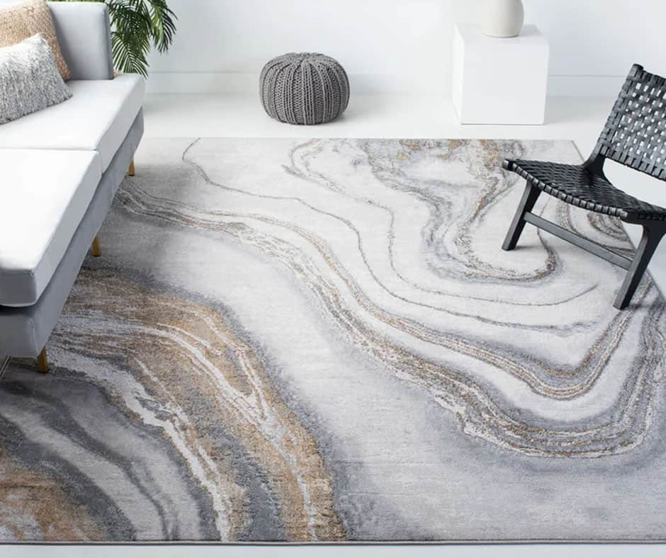 Living room with a marbled gray and white area rug