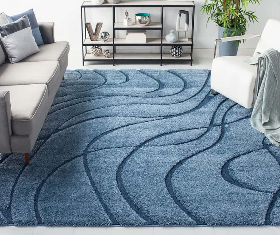 Living room with a blue curved abstract rug