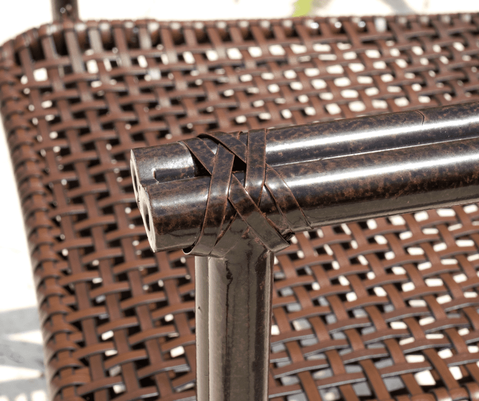 An outdoor wicker chair with a metal frame